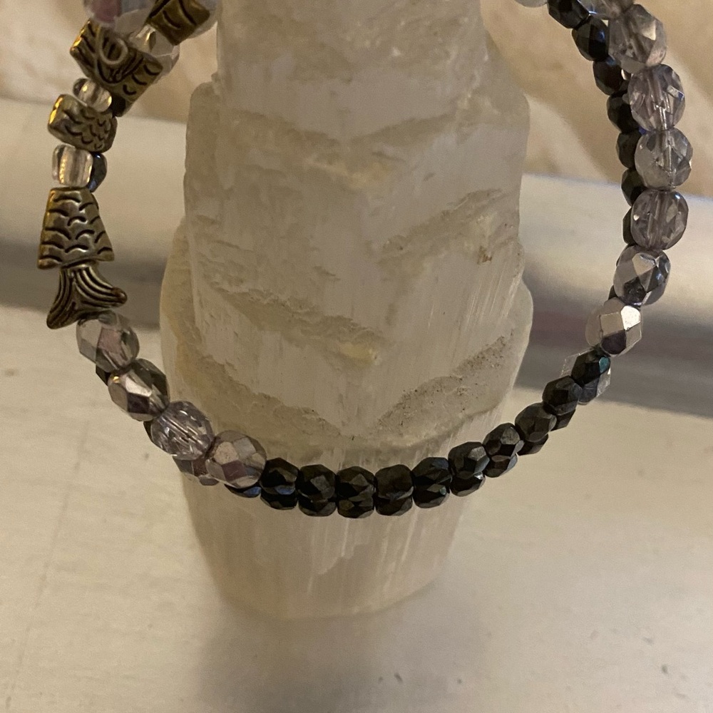 Handmade worry fish beaded bracelet .